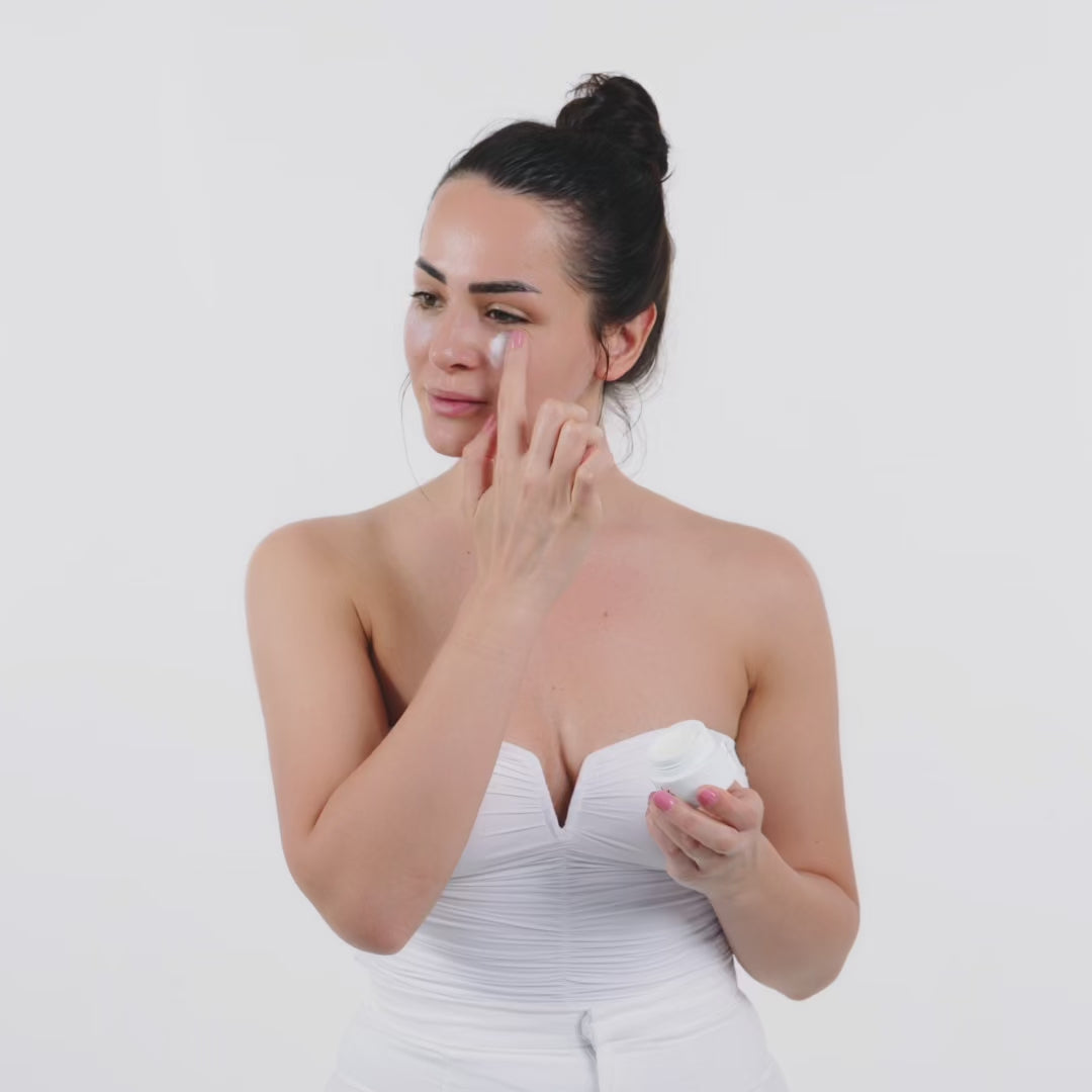 girl showing how to use the rich eye cream